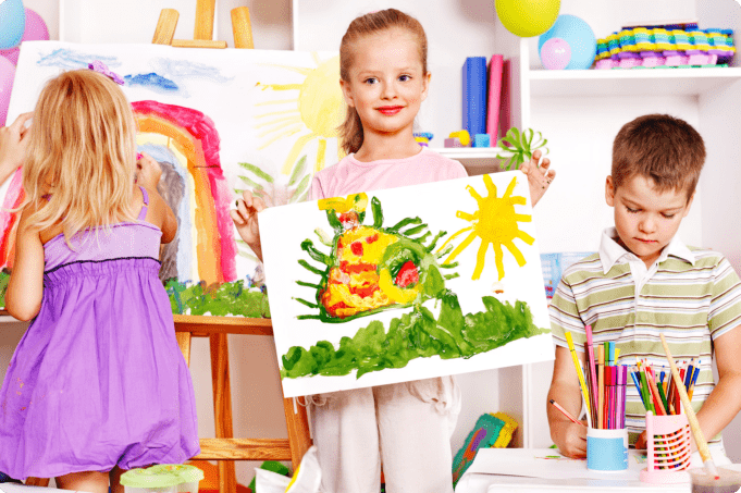 child showing her painting